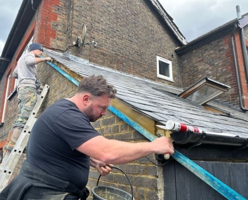 fixing up the slate roof in Kent by SE Roofers